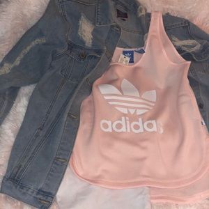 Light pink adidas shirt with white letters